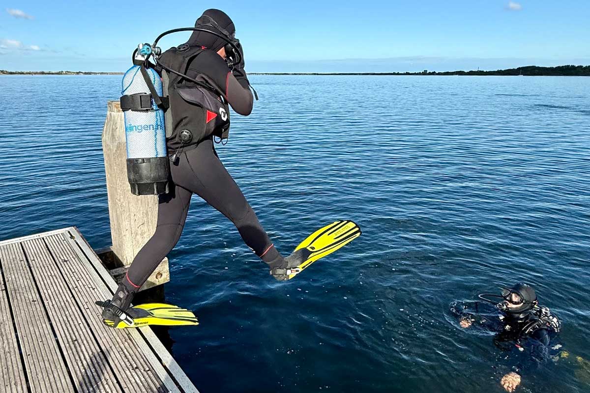 Diver giant stride entry at Kerkweg dive site, Grevelingenmeer
